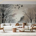 Ink Snow Landscape Wallpaper Mural | Black and White Tree Silhouettes showing snowy forest with birds in flight and minimalist ink brushstrokes (wall mural)