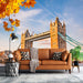 Tower Bridge Landscape Wallpaper Mural | Living Room Decoration Painting: London landmark autumn cityscape featuring Tower Bridge, warm tan sofa, cozy throws, and modern décor
