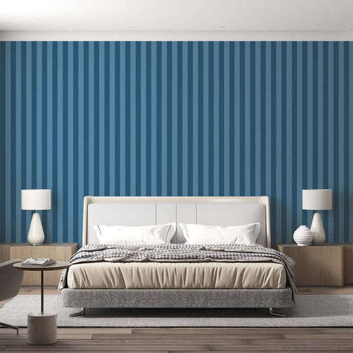 Blue Striped Wallpaper - Minimalist Ocean Dream Décor in a serene bedroom setting with vertical blue stripes behind a modern upholstered bed.