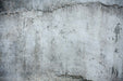 Close-up of a distressed cement wall, perfect for retro industrial cement wallpaper designs.