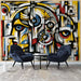 Cubist Character Wallpaper Mural | Bold Geometric Art | Modern Home Statement - vibrant cubist mural with yellow, blue, red geometric forms in a contemporary living space