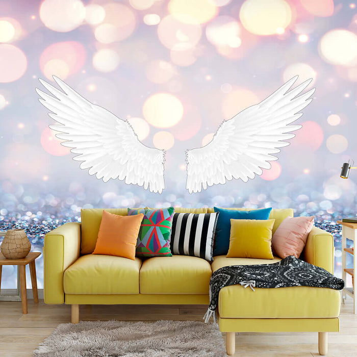 Dreamy Wings Wallpaper Mural | Sparkling Pink Starry Sky — white angel wings floating over a yellow sofa with colorful cushions in a dreamy living room