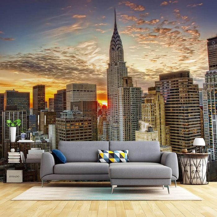 Elegant City Sunset Wallpaper Mural | Chrysler Building Skyline Art - urban sunset over NYC skyline with iconic Chrysler Building behind modern living room sofa