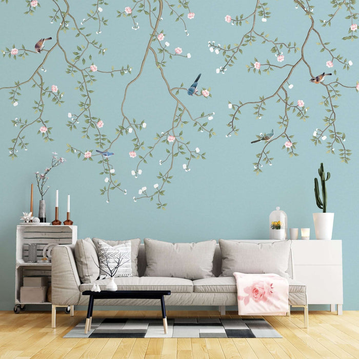 Emerald Leaves & Bird Wallpaper Mural: Light Blue Chinese Floral Motif - hand-painted nature scene with emerald leaves, pink florals, and artisan birds on a serene light blue backdrop