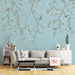 Emerald Leaves & Bird Wallpaper Mural: Light Blue Chinese Floral Motif - hand-painted nature scene with emerald leaves, pink florals, and artisan birds on a serene light blue backdrop