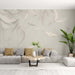 Feather Wallpaper Mural | White and Beige - serene living room backdrop with white feathers on a light beige wall, soft gray sofa, and natural decor