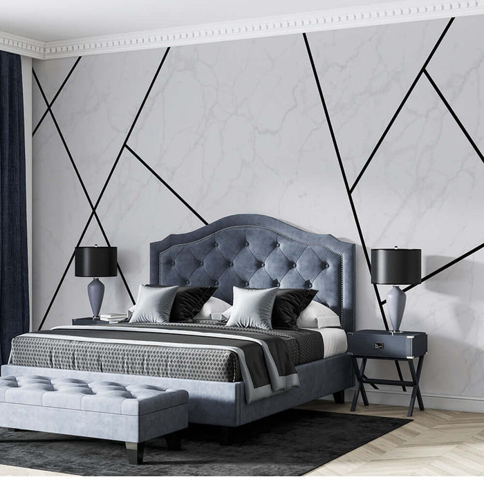 Geometric marble wallpaper | Geometric line decorative mural in elegant blue bedroom with tufted headboard, dramatic black lines, and modern nightstands