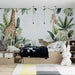 Hand drawn jungle animal wallpaper mural | Children's room bedroom playful decorative wall in a safari-inspired nursery with giraffe, leopard, monkey, and lush tropical leaves
