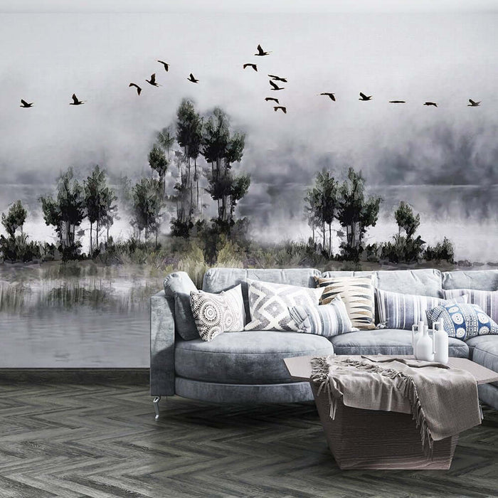 Ink Wash Landscape Wallpaper Mural | Flying Birds & Reflections | Tranquil Eastern Ambiance: serene Chinese ink wash scene with mountains, flying birds, and a misty lakeside backdrop behind a modern living room.