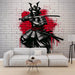 Japanese Samurai Wallpaper Mural | Black, White, and Red - dramatic samurai graffiti mural on brick wall with red ink splatter behind a seated modern living room setup
