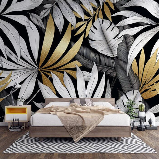 Luxury Monochrome Botanical Wallpaper Mural – Black & White Foliage with 24K Gold Accents featuring bold black-and-white leaves and gold foil details for luxurious bedroom decor
