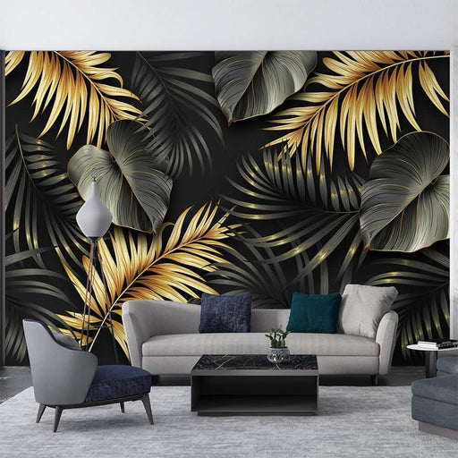 Luxury Tropical Wallpaper | Gold & Green Botanical Mural on Black — lush gold leaves and dark green foliage on matte black background in a modern living room setting