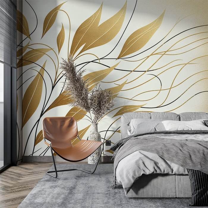 Modern Gold Leaf Line Wallpaper Mural | Minimalist Botanical Art for Luxe Interiors: gold leaf botanical wall mural in a chic bedroom with gray linens and a tan chair