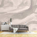 Morandi color abstract wallpaper mural | interweaving light pink and gray tones in living room with modern gray sofa and minimalist decor