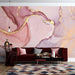 Murale d'Exception: Abstract Fluid Art Wallpaper - Pink, Purple & Gold Nuances showcases pink, purple and gold fluid art mural in a chic living room with a red sofa