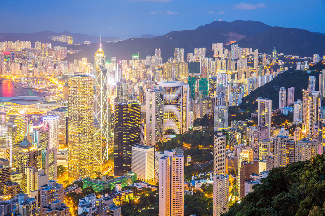 Night City Wallpaper | Urban Prosperous Landscape Mural: vibrant Hong Kong skyline at night with towering skyscrapers and illuminated harbor.
