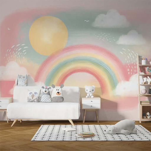 Rainbow & Cloud Wallpaper Mural | Dreamy Kids Room & Nursery Decor | Soft Watercolor Style Wall - whimsical rainbow, sun, clouds, and cute animal cushions in a dreamy nursery.