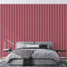 Red & Pink Striped Wallpaper – Vintage Romantic Dream: bold red and soft pink vertical stripes accenting a modern bedroom backdrop