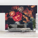 Retro dark floral wallpaper mural | Orange roses with oil painting texture in a living room setting with a grey sofa and bold flower mural