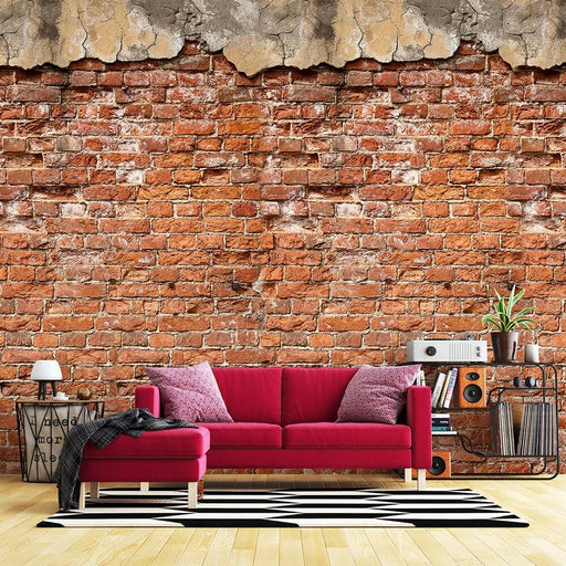 Retro Red Brick Wall Breaking Effect | Wallpaper Mural - vivid red brick wall with cracked upper layer, indoor living room featuring pink sofa, retro decor, bold texture