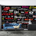 Rock band logo wallpaper mural | Classic band logo wall sticker featuring The Beatles, The Who, Queen and more on a black background with colorful fonts