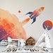 Space Rocket Wallpaper Mural — Sci-Fi Kids Room Decor | Cosmic Bedroom & Living Room Accent Wall featuring a bold orange-purple gradient rocket art for a dreamy space-inspired kids room