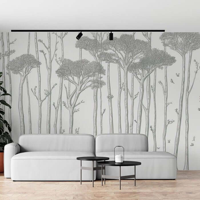 Tree wallpaper mural | Black and white forest: minimalist Nordic line art of tall trees with birds, serene living room backdrop, modern black track lighting above sofa