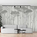 Tree wallpaper mural | Black and white forest: minimalist Nordic line art of tall trees with birds, serene living room backdrop, modern black track lighting above sofa