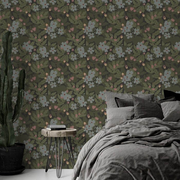 Vintage Floral Wallpaper | Botanical Green Leaf Mural with Subtle Blue & Pink Blooms in a cozy bedroom setting