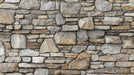 Vintage stone wall texture wallpaper, showcasing a rough, natural stone design for industrial-style decor.
