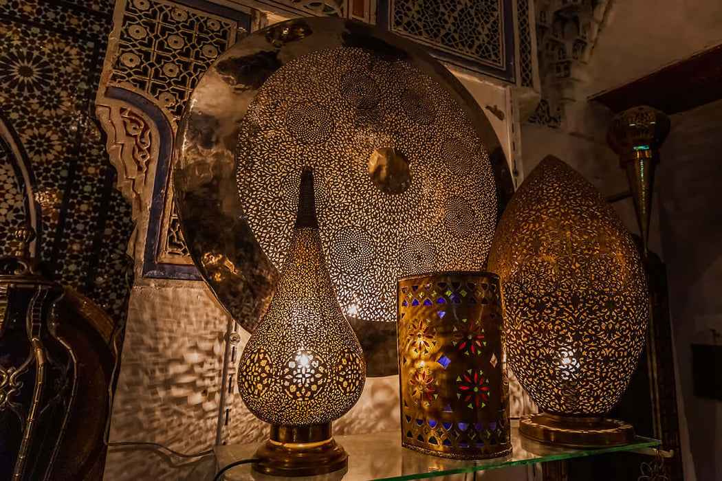 Vintage metal craft wallpaper mural | Metal lamp - Moroccan-inspired metal hollow lamp wallpaper with warm gold lighting and intricate patterns