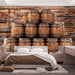 Vintage wine barrel wallpaper featuring stacked wooden barrels in a cozy bedroom setting.