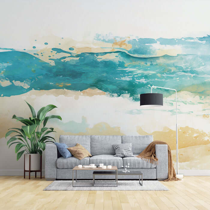 Watercolor beach art wallpaper mural in a living room setting with modern decor and plant accents.
