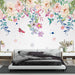 Watercolor flower bird wallpaper showcasing vibrant flowers and birds above a stylish bedroom setting.