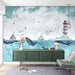 Watercolor ocean whale wallpaper featuring whales, boats, and a lighthouse in a serene living space.