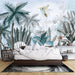 Watercolor tropical plant wallpaper featuring lush vegetation and a hummingbird above a cozy bedroom setting.